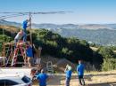 Lamorinda Area Radio Interest Group members raise their triband yagi at K6ORI, Lafayette Ridge, California. (KM6ORH photo)